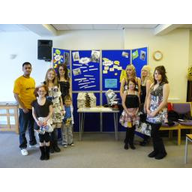 Young people modelling some of the garments they made with materials that had been thrown away.
