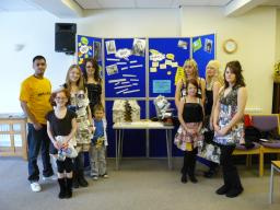Young people modelling some of the garments they made with materials that had been thrown away.