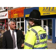 Cllr David Ward talks with local police in Idle Village