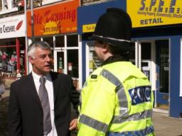 Cllr David Ward talks with local police in Idle Village