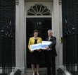 David and Jeanette present cheque petition to Downing Street