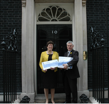 David and Jeanette present cheque petition to Downing Street