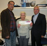 David Ward MP presenting a cheque to Shazad Parvez from SCAR and Anne Keegan Manningham from Mills Sports Association