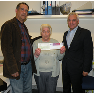David Ward MP presenting a cheque to Shazad Parvez from SCAR and Anne Keegan Manningham from Mills Sports Association