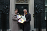 David Ward and Jeanette Sunderland presenting the Send My Friend to School petition at Number 10 Downing Street