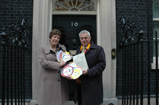 David Ward and Jeanette Sunderland presenting the Send My Friend to School petition at Number 10 Downing Street