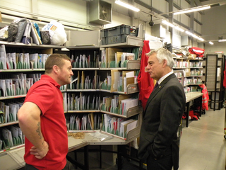 David Ward MP speaking with a Postman at the Bradford North delivery office
