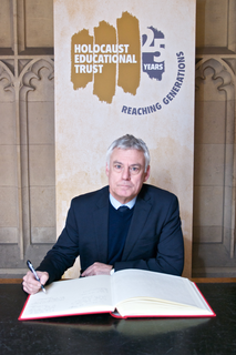 David Ward MP signing the Book of Commitment