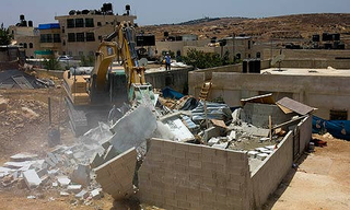 A Palestinian house being demolished